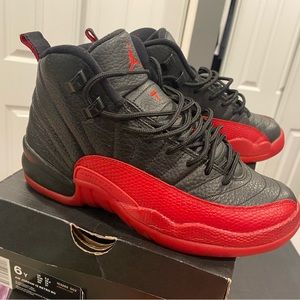 Black and Red Jordan 12 size 6 in mens, 8 in woman